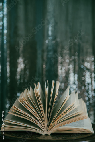 Open book  with bokeh effect in the background