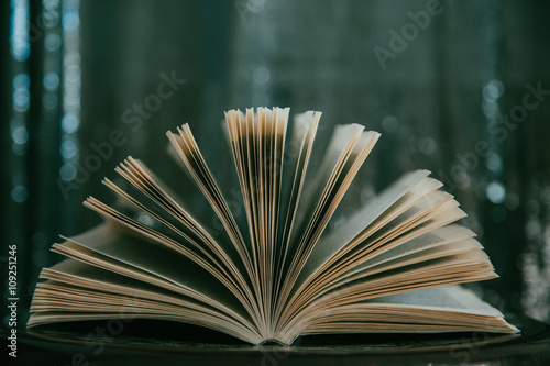 Open book  with bokeh effect in the background