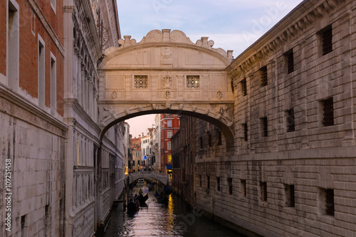 Gondolas passing under Bridge of Sighs, Ponte dei Sospiri. A legend says that lovers will be granted eternal love if they kiss on a gondola at sunset under the Bridge. Venice,Veneto, Italy, Europe. 