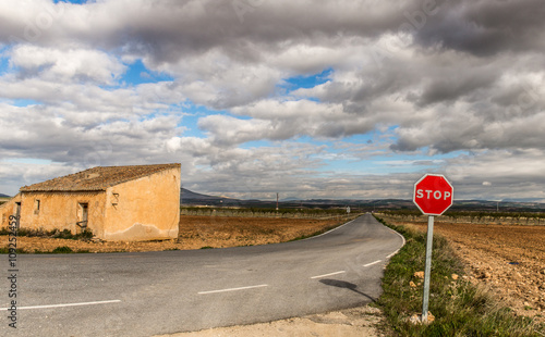 Old deserted barn in the meadow and hills of Andalusia, Spain photo