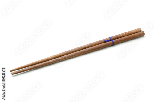 Wooden teak chopsticks isolated on white background.