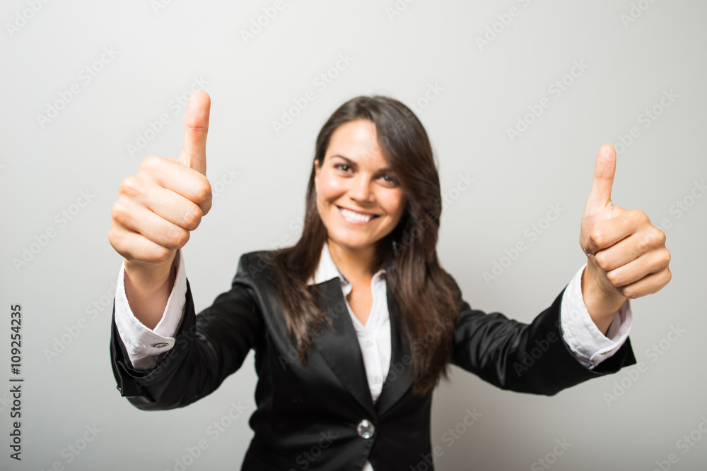 Business woman shows thumb up Business woman shows thumb up