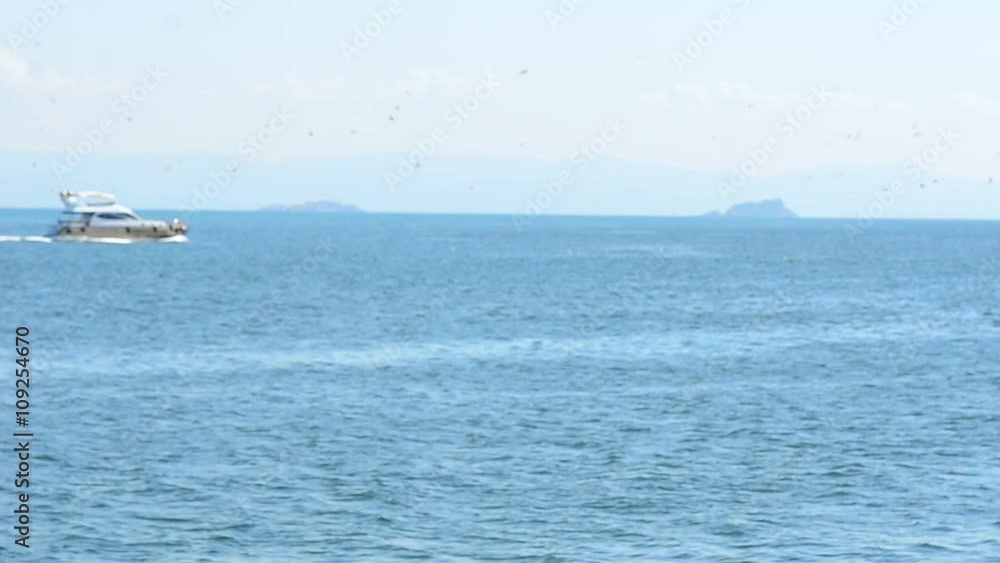 beautiful view on the coast from the ferry. arabic tropical country. many mosques and buildings. warm blue water. sunny day summer. yachts and boats. happy people celebrating beautiful view on the coast from the ferry. arabic tropical country. many mosques and buildings. warm blue water. sunny day summer. yachts and boats. happy people celebrating