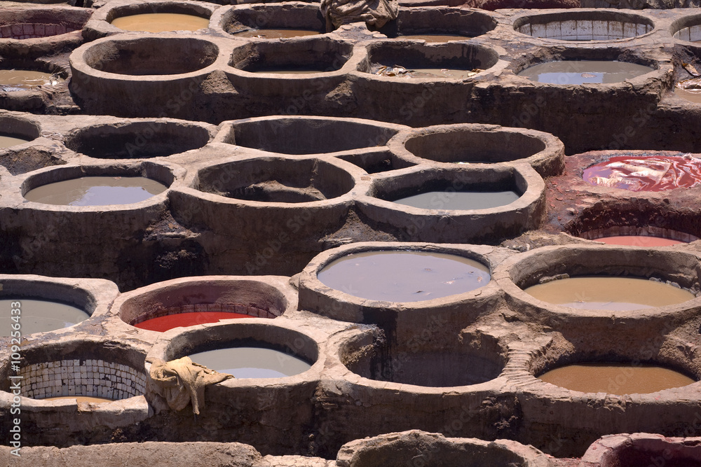 Morocco. Fez (Fes el-Bali). The tanner's quarter - close up of tubs (bend) with dyes in them