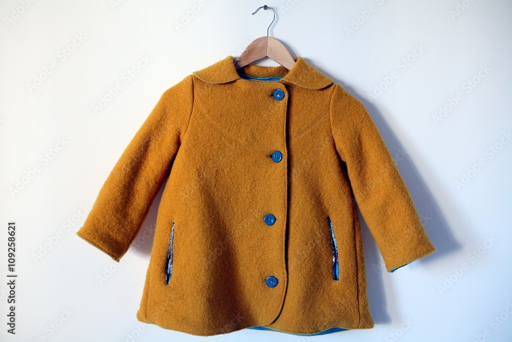 Manteau enfant en laine bouillie jaune Stock Photo | Adobe Stock