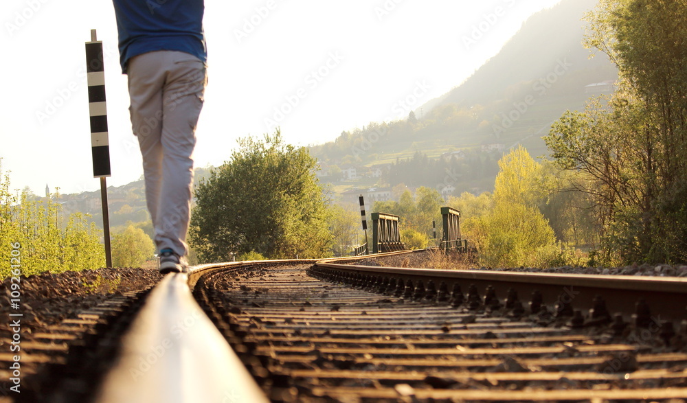man walking on the railway , concept of freedom man walking on the railway , concept of freedom