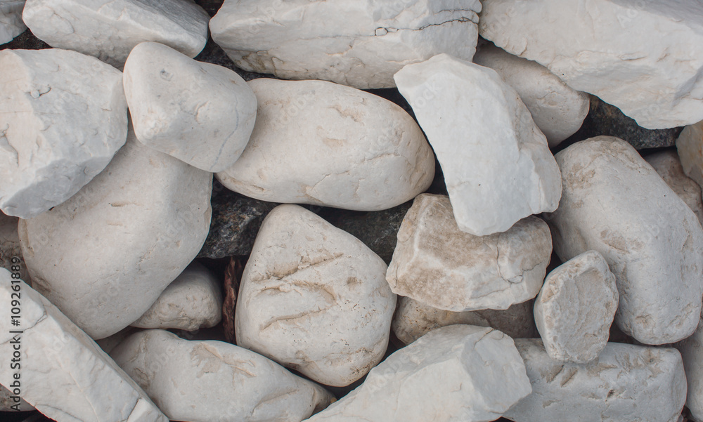 Close-up. White stones. Texture. Background. Close-up. White stones. Texture. Background.