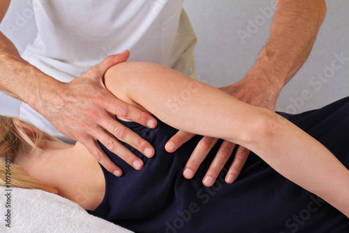 Chiropractic, osteopathy, dorsal manipulation. Therapist doing healing treatment otreatment on woman's back . Alternative medicine, pain relief concept
