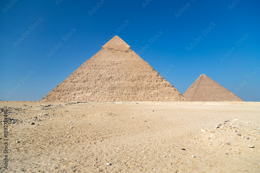 Pyramids of Giza complex ( Egypt) against the clear blue sky.