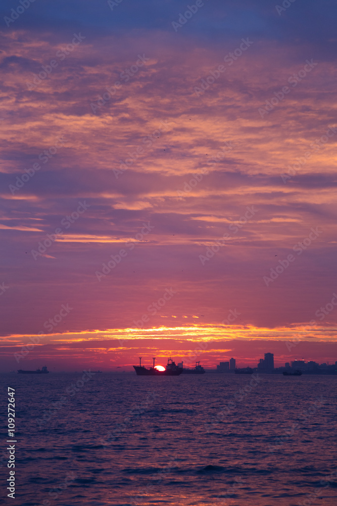 Fototapeta premium Boats on horizon at sunset on Bosphorus, Turkey.