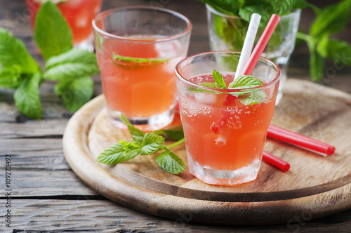 Fresh alcohol cocktail with rum, berry and mint