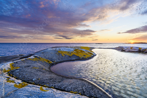 Scenic coast at sunset photo