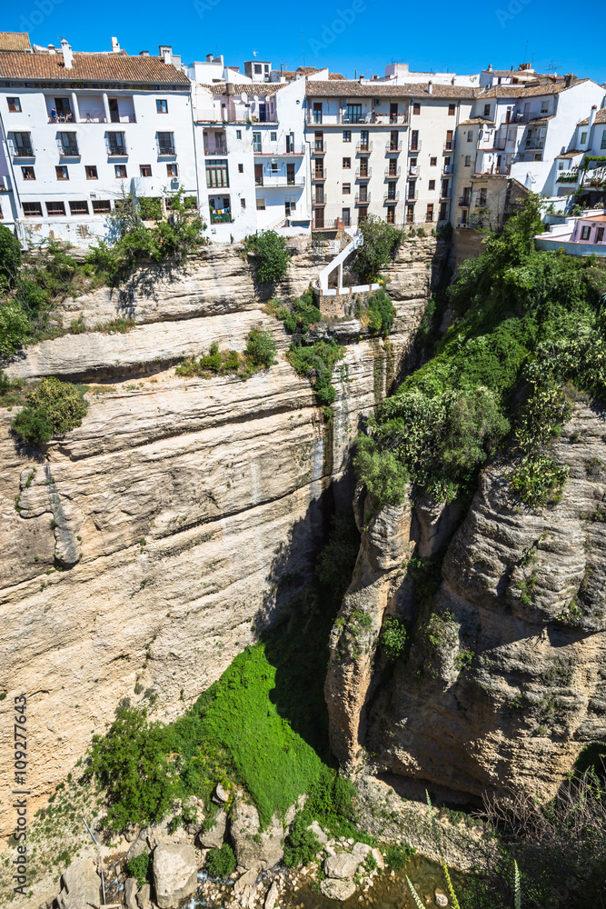 view of buildings over cliff in ronda, spain