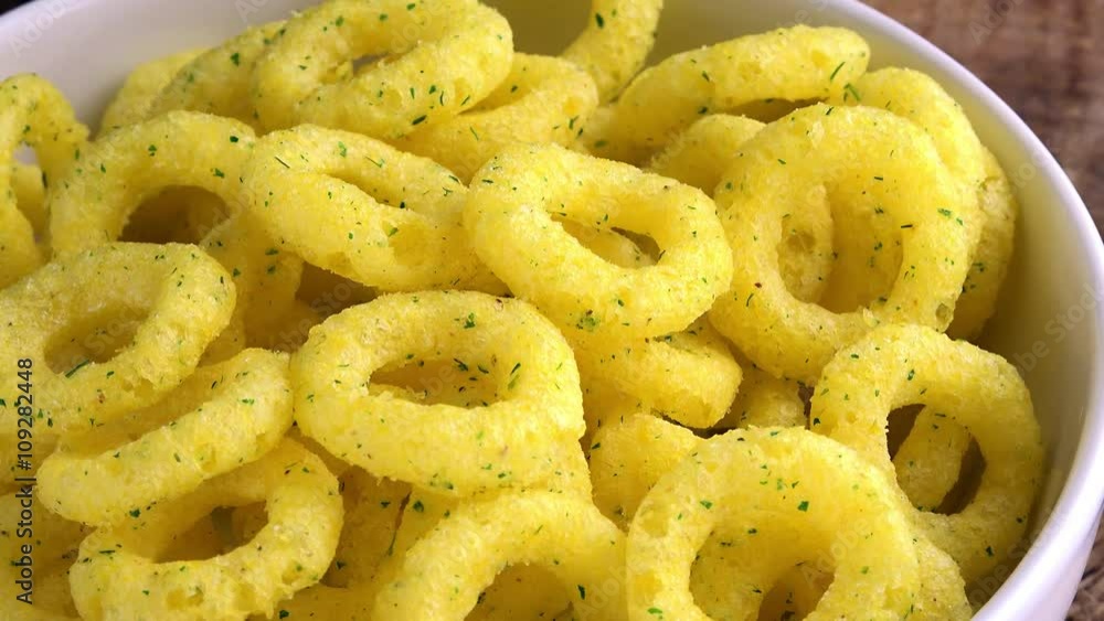 Portion of crispy Onion Snacks as seamless loopable 4K UHD footage Portion of crispy Onion Snacks as seamless loopable 4K UHD footage