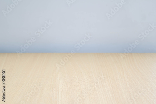 Empty perspective wood over color blur background