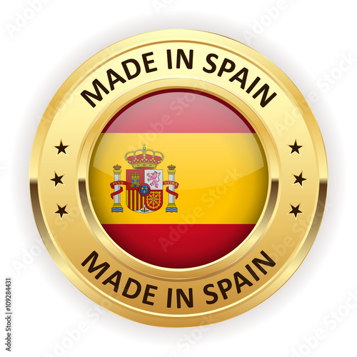 Made in spain button with gold border on white background