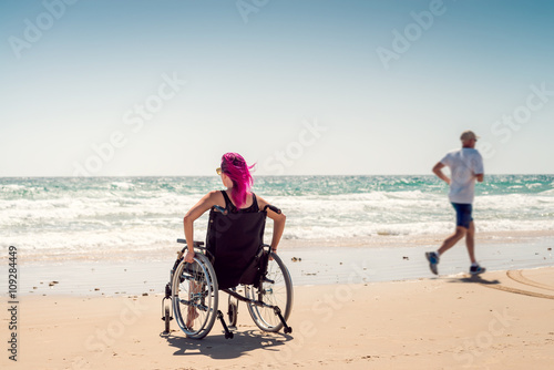 Disabled woman and running man
