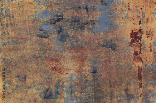 Abstract corroded colorful wallpaper grunge background. Iron rusty artistic wall peeling paint © tannujannu