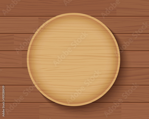 wooden plate on wood table background