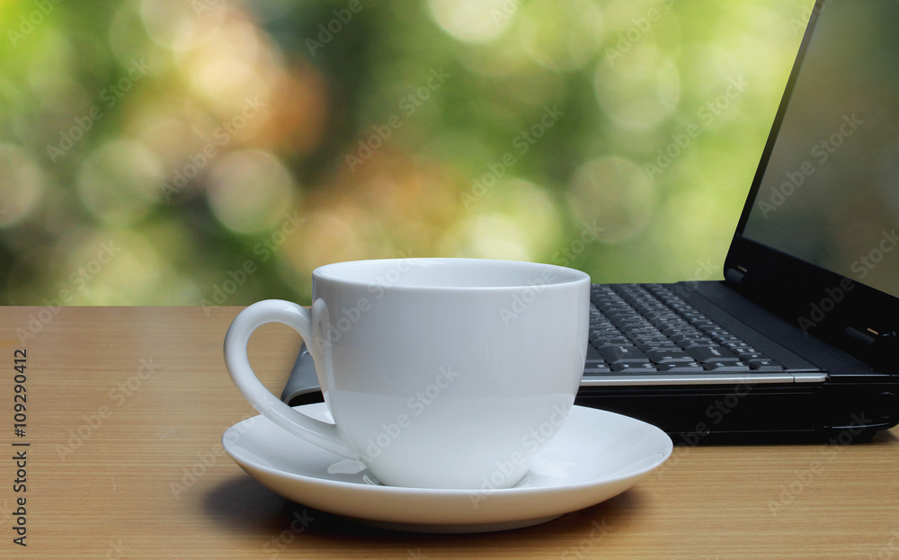 Cup of coffee on the wooden floor and bokeh background Cup of coffee on the wooden floor and bokeh background