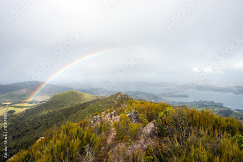 Rainbow with Otago peninsula landscape, South island, New Zealand