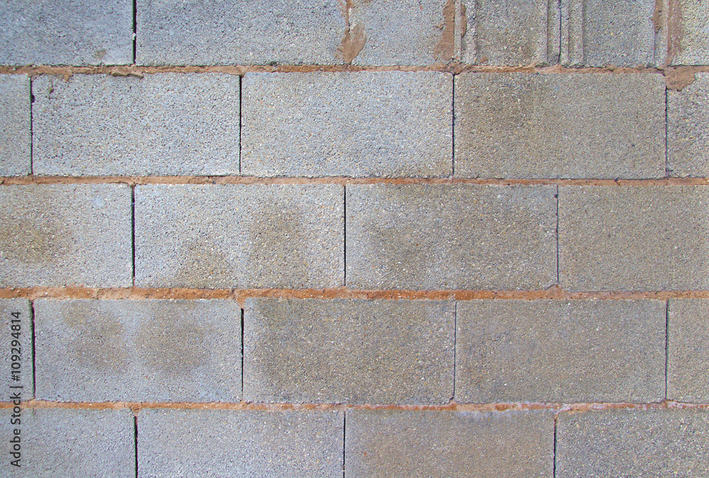 View of a grey brick wall. Background image View of a grey brick wall. Background image
