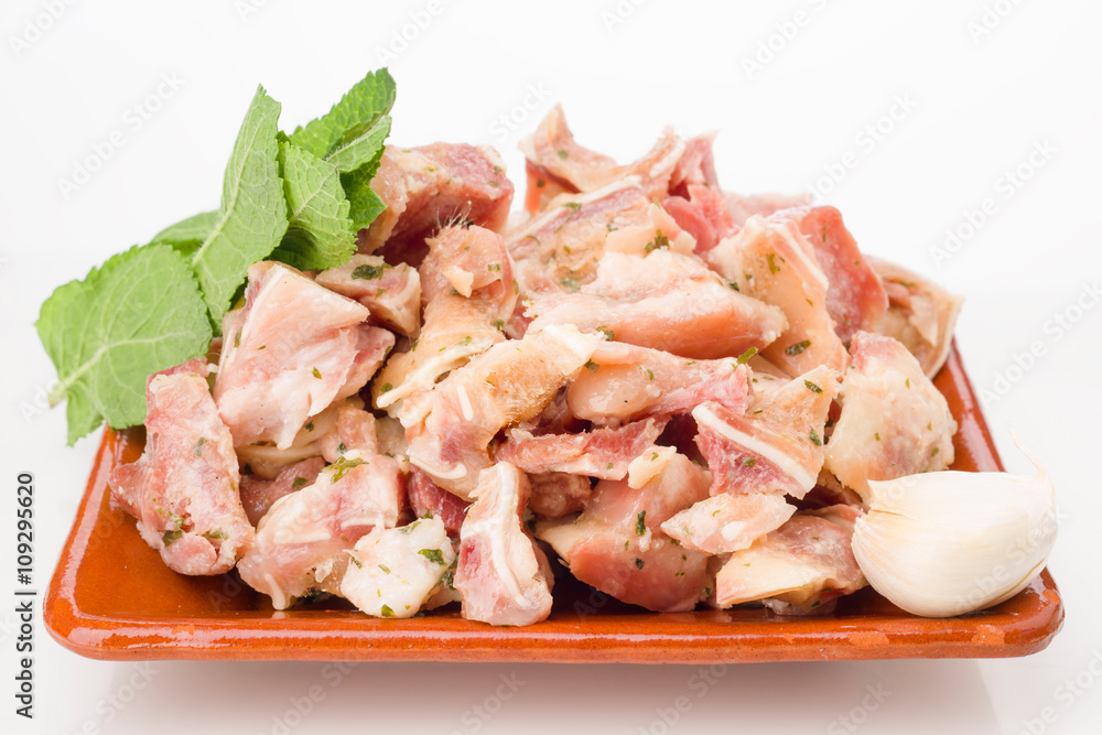pig's ear cut into with condiments isolated on white pig's ear cut into with condiments isolated on white