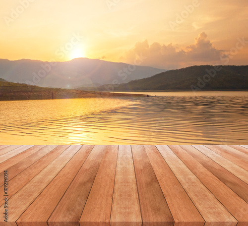 wooden table top and beautiful landscape with sunrise or sunset   © Thanakorn Thaneevej