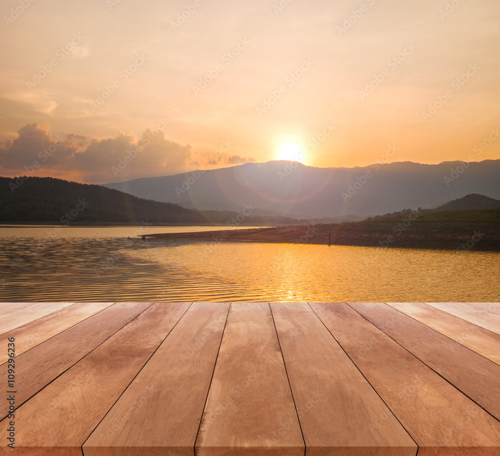 wooden table top and beautiful landscape with sunrise or sunset  