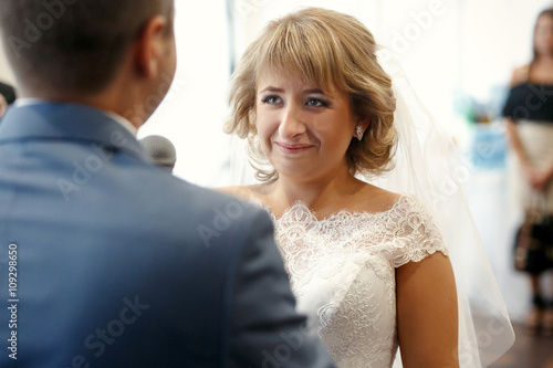 Happy beautiful newlyweds in restaurant