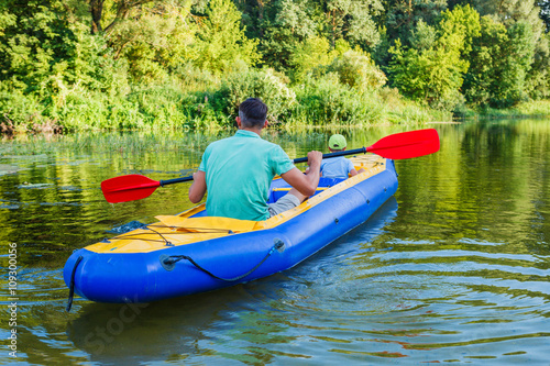 Family kayaking on the river