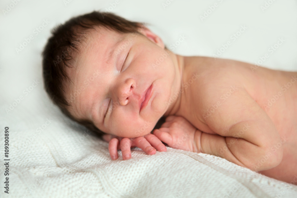 sleeping newborn baby on a blanket
sleeping newborn baby on a blanket