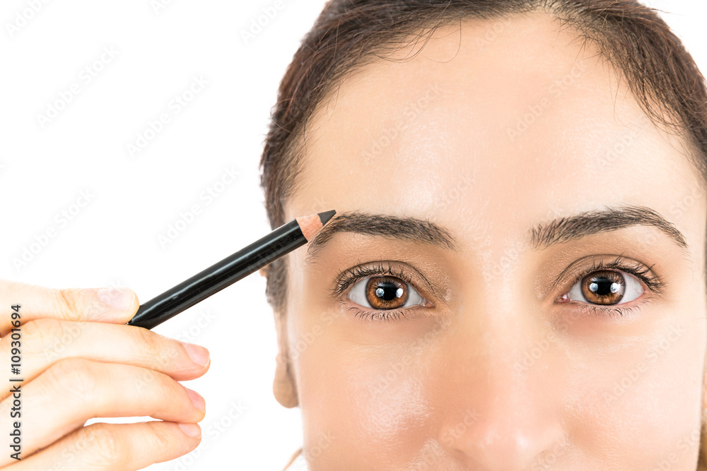 Painting the eyebrows with an eyebrow pencil Painting the eyebrows with an eyebrow pencil