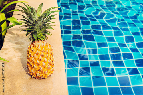 Healthy diet food. Pineapple at the swimming pool