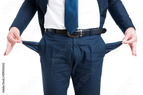 Obraz na płótnie Poor businessman showing empty pants pockets