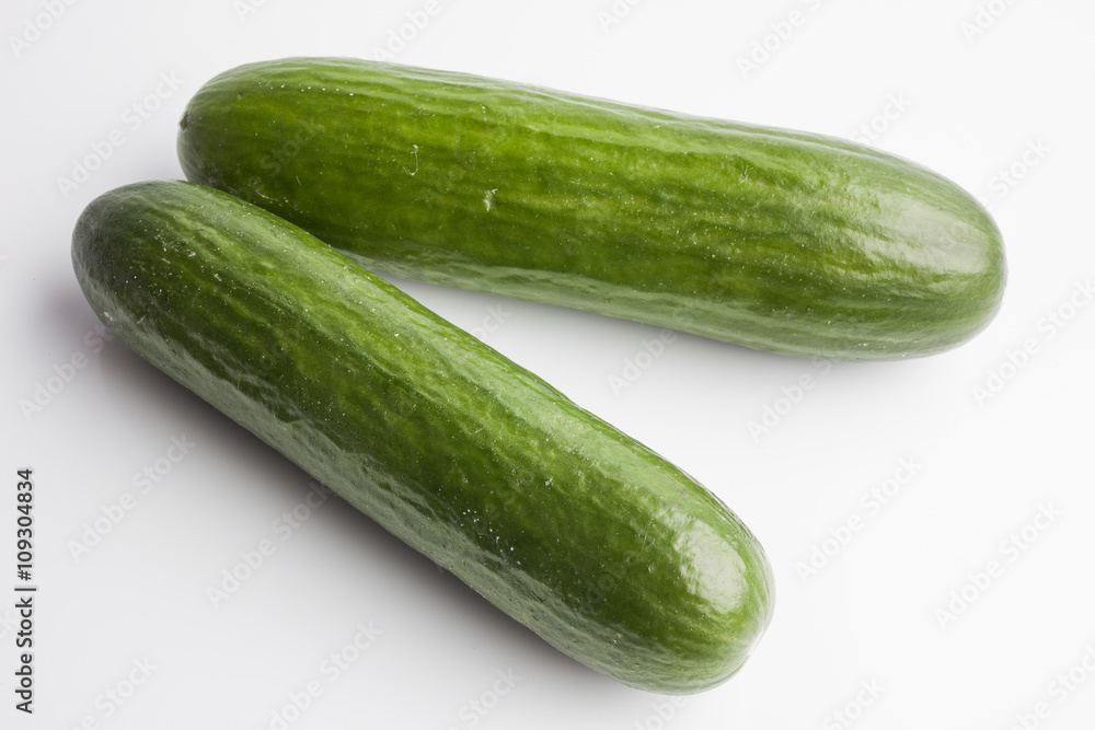 Two whole big cucumbers on white background Two whole big cucumbers on white background