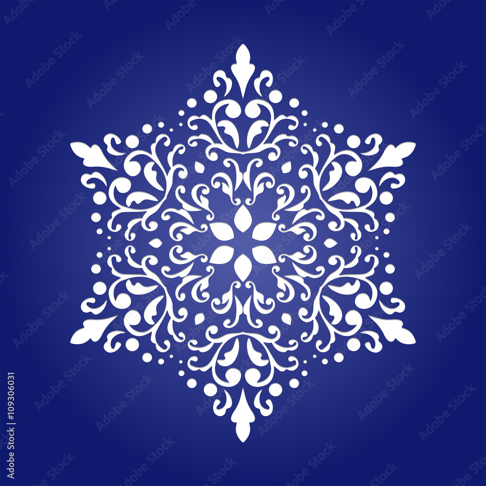 Die cut paper card with cutout mandala ornament. 