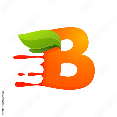 B letter with orange juice drops and leaves.