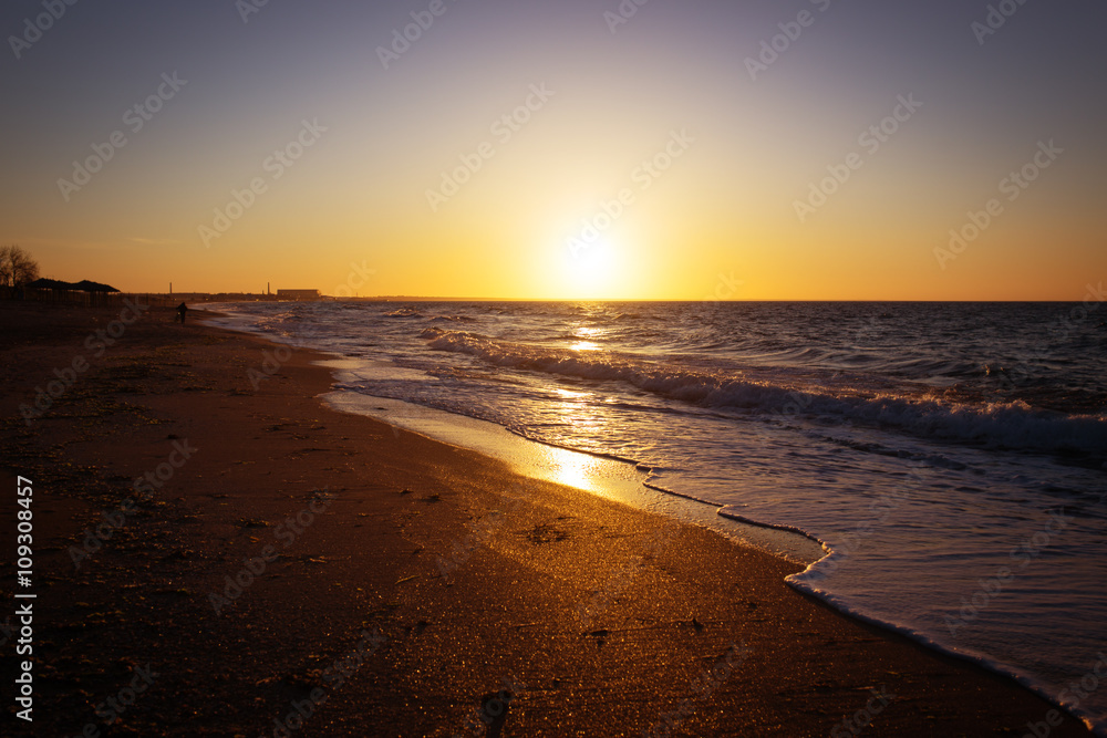 Beautiful sunset view and waves on the beach