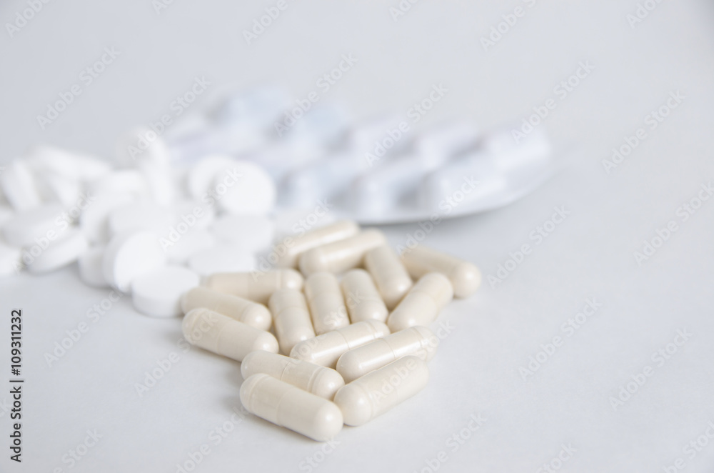 Pills and tablets in capsule on white isolated background Pills and tablets in capsule on white isolated background