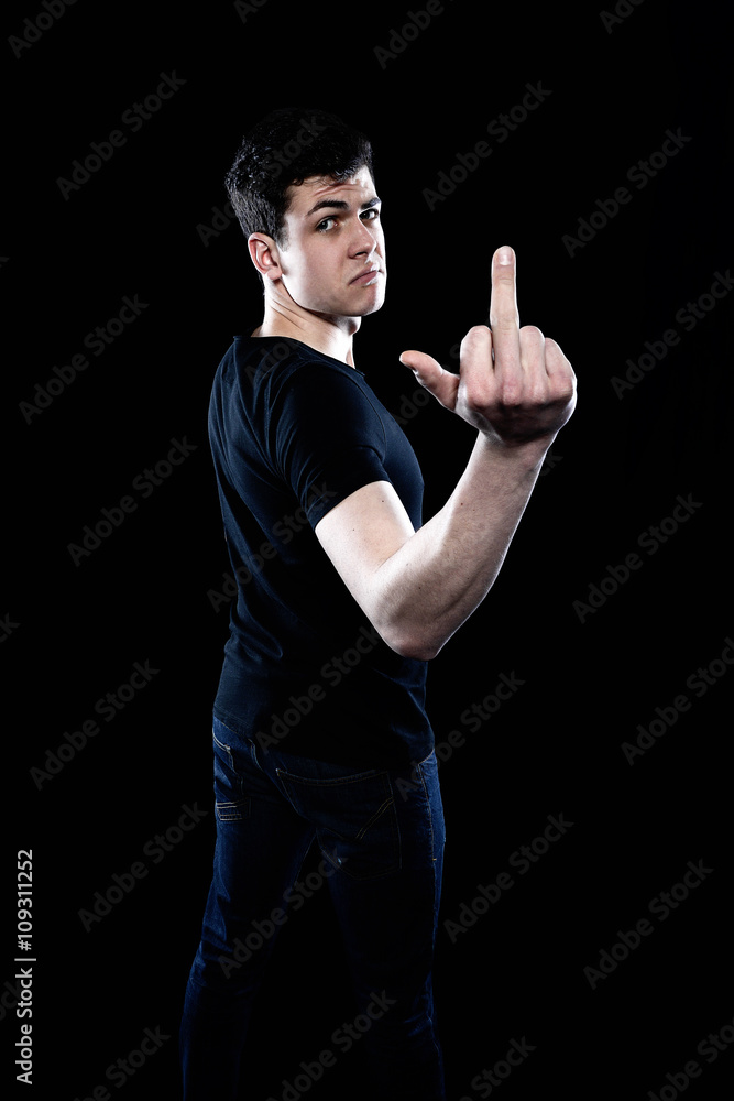 young man showing his middle finger
young man showing his middle finger