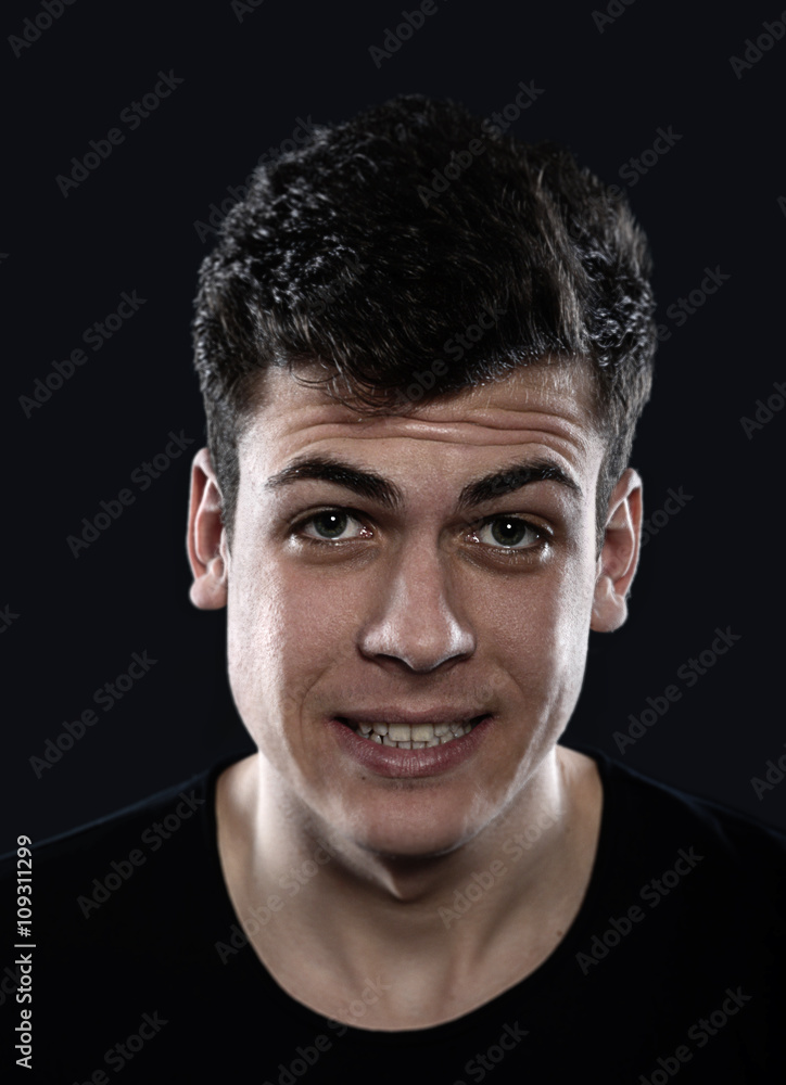 Fototapeta premium surprised young man studio portrait 