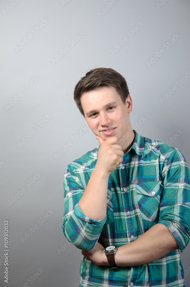 portrait of young student man over grey background portrait of young student man over grey background