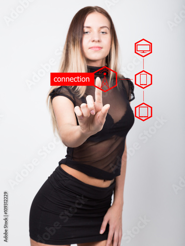 technology, internet and networking concept. beautiful woman in a short black skirt and a transparent top. woman presses connect button on virtual screens