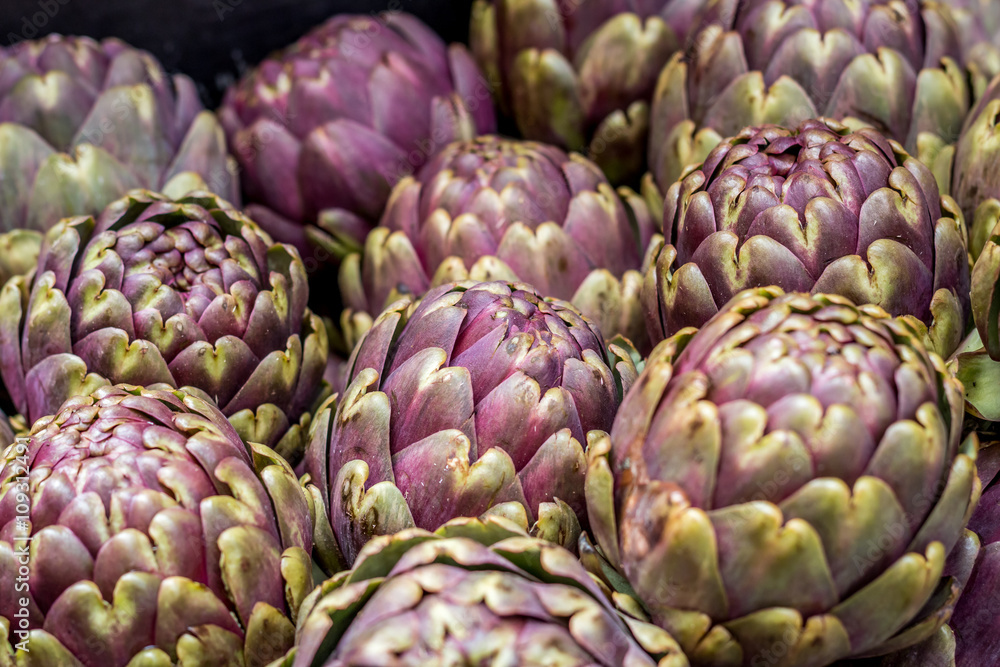 lots of artichokes in the market lots of artichokes in the market
