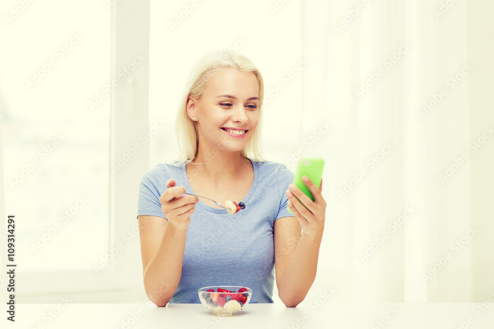 woman with smartphone eating fruits at home woman with smartphone eating fruits at home