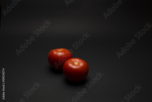 tomatoes on a black table
