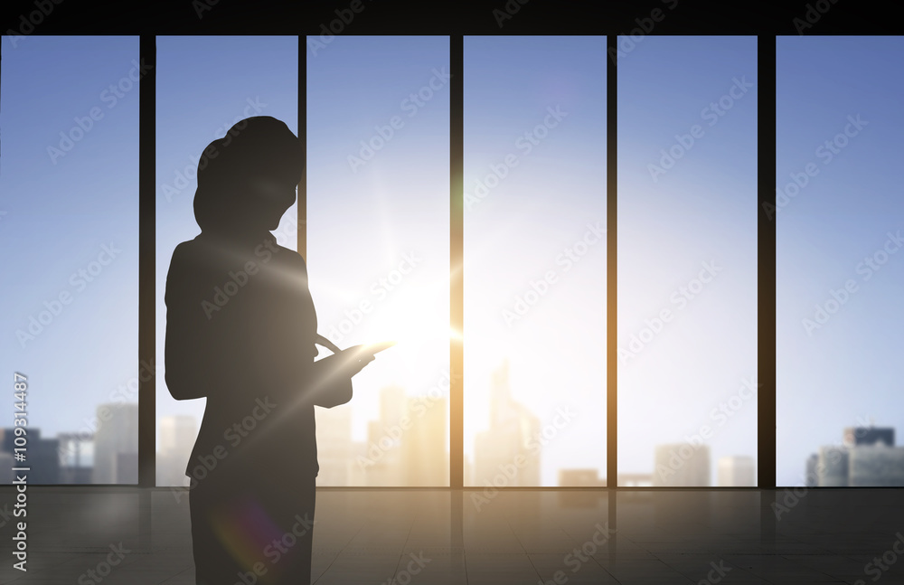 silhouette of business woman with tablet pc