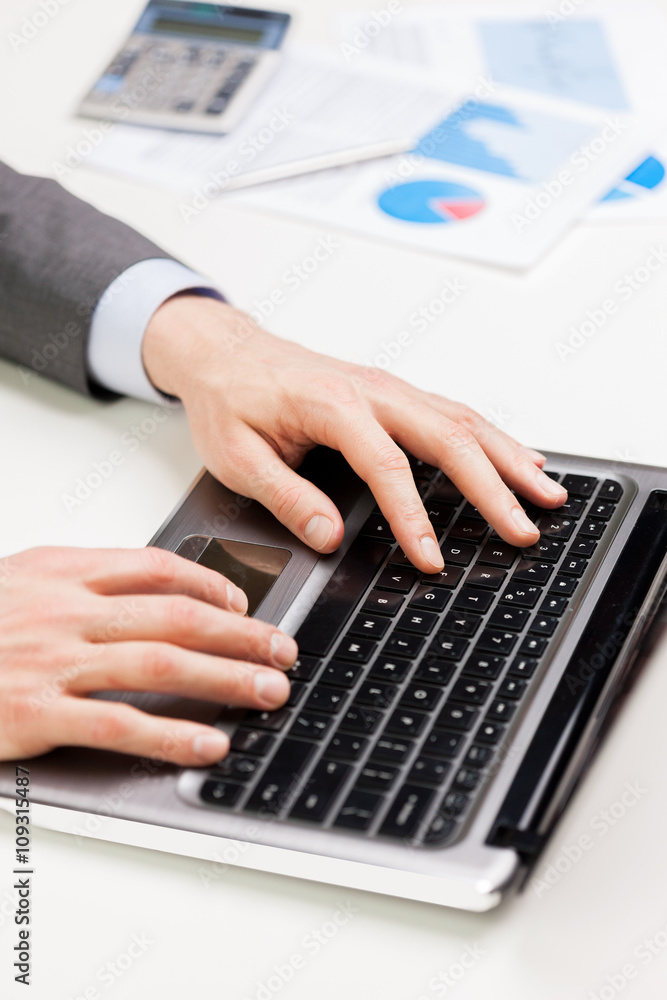 close up of businessman hands typing on laptop close up of businessman hands typing on laptop