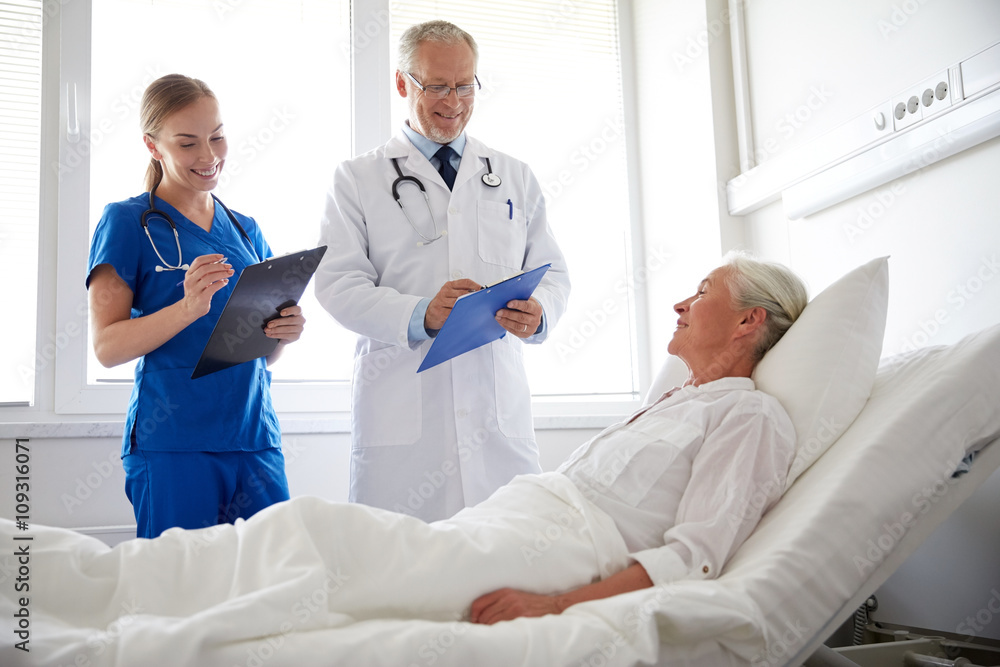 Fototapeta premium doctor and nurse visiting senior woman at hospital